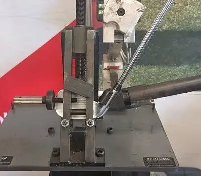 Loft and lie bending machine in use at the Blades Golf Repair workshop